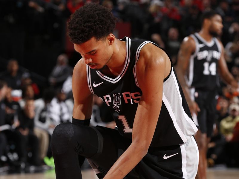 PORTLAND, OR - DECEMBER 13: Victor Wembanyama #1 of the San Antonio Spurs looks on during the game against the Portland Trail Blazers on December 13, 2024 at the Moda Center Arena in Portland, Oregon. NOTE TO USER: User expressly acknowledges and agrees that, by downloading and or using this photograph, user is consenting to the terms and conditions of the Getty Images License Agreement. Mandatory Copyright Notice: Copyright 2024 NBAE (Photo by Cameron Browne/NBAE via Getty Images)