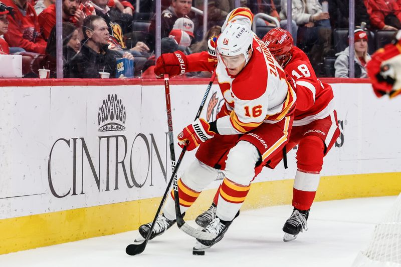 Oct 22, 2023; Detroit, Michigan, USA;  Calgary Flames defenseman Nikita Zadorov (16) skates with the puck chased by Detroit Red Wings center Andrew Copp (18) in the second period at Little Caesars Arena. Mandatory Credit: Rick Osentoski-USA TODAY Sports