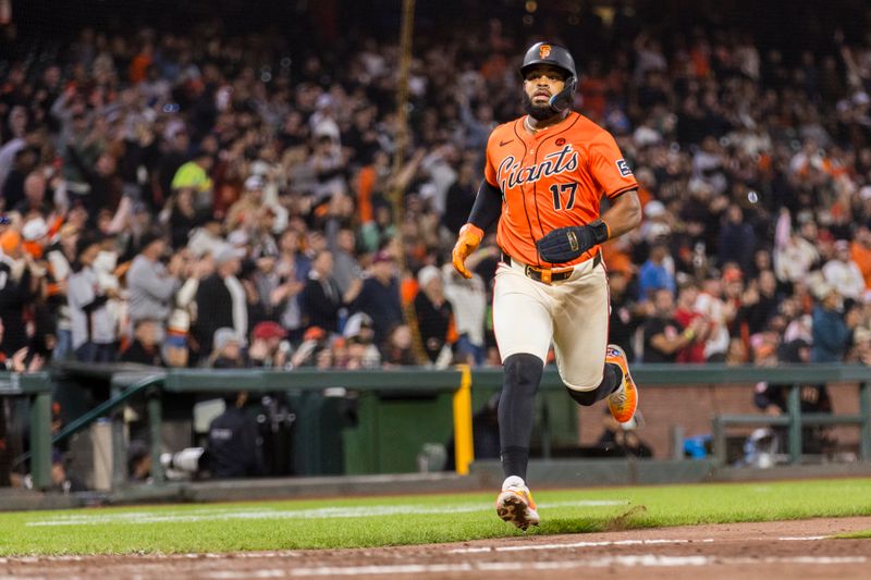 Jul 12, 2024; San Francisco, California, USA; San Francisco Giants center fielder Heliot Ramos (17) scores against the Minnesota Twins during the seventh inning at Oracle Park. Mandatory Credit: John Hefti-USA TODAY Sports