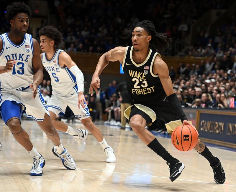 Feb 12, 2024; Durham, North Carolina, USA;  Wake Forest Deamon Deacons guard Hunter Sallis (23) drives to the basket as Duke Blue Devils forward Sean Stewart (13) defends during the first half at Cameron Indoor Stadium. Mandatory Credit: Rob Kinnan-USA TODAY Sports