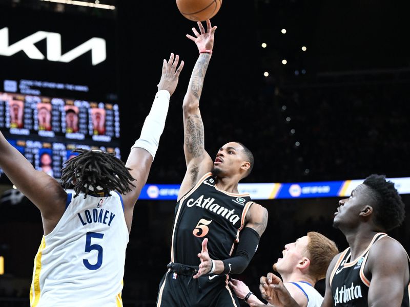ATLANTA, GA - MARCH 17: Dejounte Murray #5 of the Atlanta Hawks shoots the ball during the game against the Golden State Warriors on March 17, 2023 at State Farm Arena in Atlanta, Georgia.  NOTE TO USER: User expressly acknowledges and agrees that, by downloading and/or using this Photograph, user is consenting to the terms and conditions of the Getty Images License Agreement. Mandatory Copyright Notice: Copyright 2023 NBAE (Photo by Adam Hagy/NBAE via Getty Images)