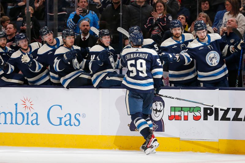 Dec 21, 2023; Columbus, Ohio, USA; Columbus Blue Jackets right wing Yegor Chinakhov (59) celebrates his goal against the Washington Capitals during the third period at Nationwide Arena. Mandatory Credit: Russell LaBounty-USA TODAY Sports