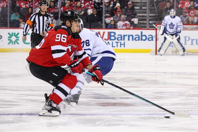 Mar 7, 2023; Newark, New Jersey, USA; New Jersey Devils right wing Timo Meier (96) plays the puck against the Toronto Maple Leafs during the first period at Prudential Center. Mandatory Credit: Ed Mulholland-USA TODAY Sports