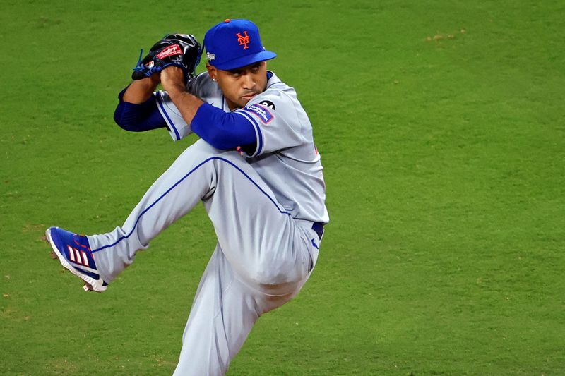 Oct 20, 2024; Los Angeles, California, USA; New York Mets pitcher Edwin Díaz (39) pitches during the fourth inning against the Los Angeles Dodgers during game six of the NLCS for the 2024 MLB playoffs at Dodger Stadium. Mandatory Credit: Kiyoshi Mio-Imagn Images