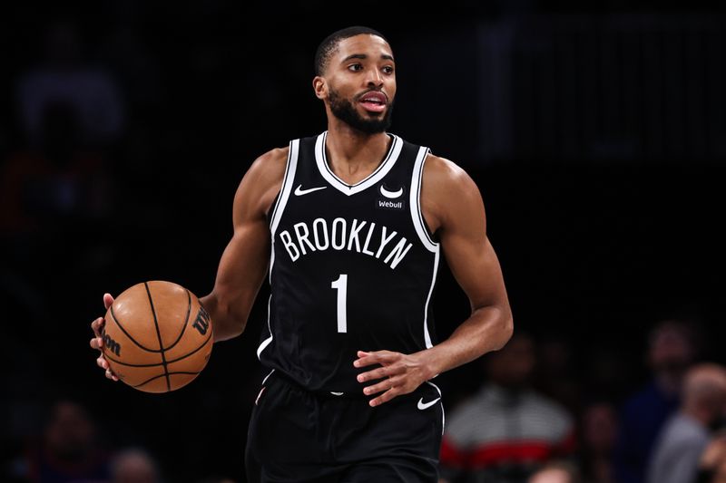 NEW YORK, NEW YORK - JANUARY 23: Mikal Bridges #1 of the Brooklyn Nets brings the ball up the court during the first quarter of the game against the New York Knicks at Barclays Center on January 23, 2024 in New York City.  NOTE TO USER: User expressly acknowledges and agrees that, by downloading and or using this photograph, User is consenting to the terms and conditions of the Getty Images License Agreement. (Photo by Dustin Satloff/Getty Images)