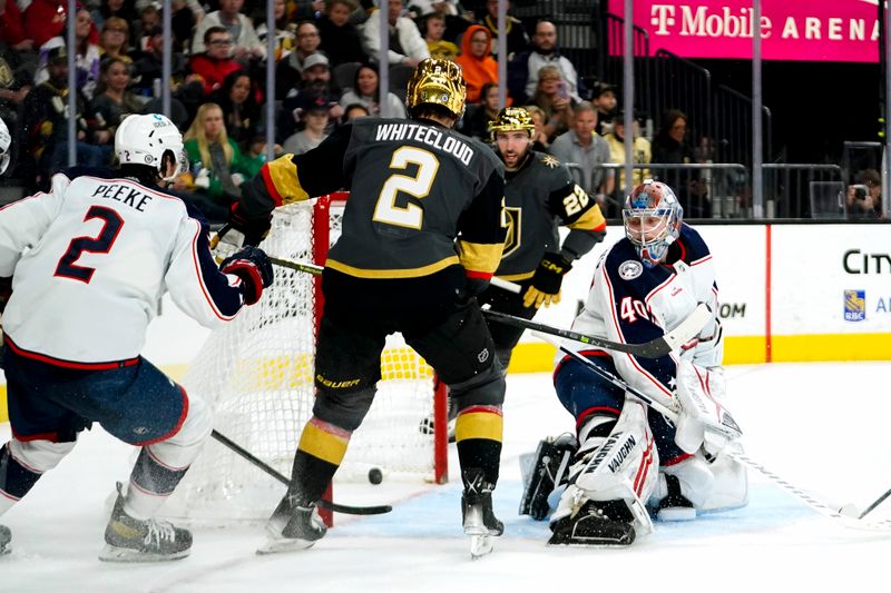 Mar 19, 2023; Las Vegas, Nevada, USA; Vegas Golden Knights defenseman Zach Whitecloud (2) scores against Columbus Blue Jackets goaltender Daniil Tarasov (40) during the second period at T-Mobile Arena. Mandatory Credit: Lucas Peltier-USA TODAY Sports