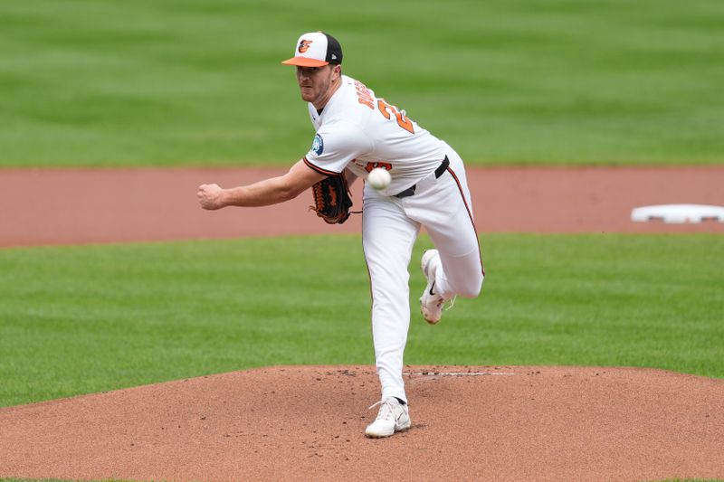 Aug 24, 2025; Baltimore, Maryland, USA; Baltimore Orioles pitcher Trevor Rogers (28) delivers a pitch against the Houston Astros during the first inning at Oriole Park at Camden Yards. Mandatory Credit: Gregory Fisher-Imagn Images