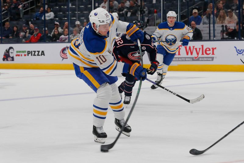 Oct 17, 2024; Columbus, Ohio, USA; Buffalo Sabres defenseman Henri Jokiharju (10) wrists a shot on goal against the Columbus Blue Jackets during the third period at Nationwide Arena. Mandatory Credit: Russell LaBounty-Imagn Images