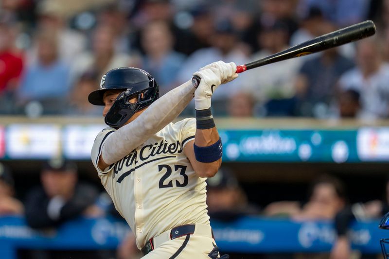 Sep 16, 2025; Minneapolis, Minnesota, USA; Minnesota Twins third baseman Royce Lewis (23) hits a RBI single against the New York Yankees in the first inning at Target Field. Mandatory Credit: Jesse Johnson-Imagn Images