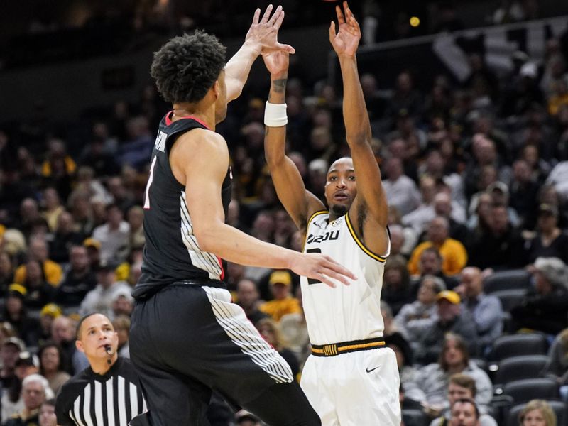 Jan 6, 2024; Columbia, Missouri, USA; Missouri Tigers guard Tamar Bates (2) shoots a three point shot over Georgia Bulldogs guard Jabri Abdur-Rahim (1) during the first half at Mizzou Arena. Mandatory Credit: Denny Medley-USA TODAY Sports