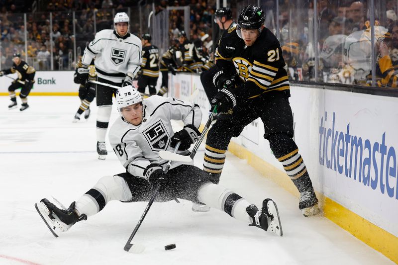 Feb 17, 2024; Boston, Massachusetts, USA; Los Angeles Kings right wing Alex Laferriere (78) goes down trying to play the puck against Boston Bruins left wing James van Riemsdyk (21) during the first period at TD Garden. Mandatory Credit: Winslow Townson-USA TODAY Sports