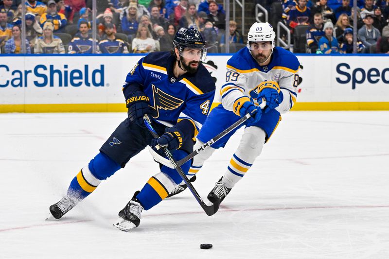 Nov 30, 2023; St. Louis, Missouri, USA;  St. Louis Blues defenseman Nick Leddy (4) and Buffalo Sabres right wing Alex Tuch (89) battle for the puck during the first period at Enterprise Center. Mandatory Credit: Jeff Curry-USA TODAY Sports