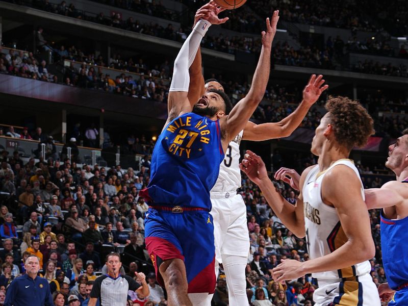 DENVER, CO - JANUARY 12: Jamal Murray #27 of the Denver Nuggets grabs a rebound during the game against the New Orleans Pelicans on January 12, 2024 at the Ball Arena in Denver, Colorado. NOTE TO USER: User expressly acknowledges and agrees that, by downloading and/or using this Photograph, user is consenting to the terms and conditions of the Getty Images License Agreement. Mandatory Copyright Notice: Copyright 2024 NBAE (Photo by Garrett Ellwood/NBAE via Getty Images)