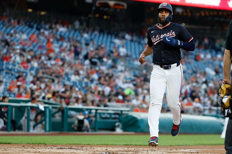 Apr 24, 2025; Washington, District of Columbia, USA; Washington Nationals third base Amed Rosario (13) scores a run on an RBI single by Nationals first base Josh Bell (not pictured) against the Baltimore Orioles during the second inning at Nationals Park. Mandatory Credit: Geoff Burke-Imagn Images