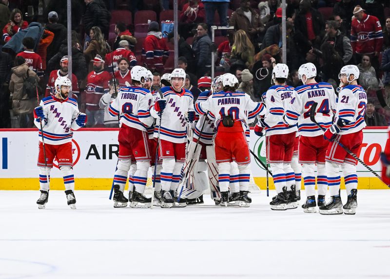 Mar 9, 2023; Montreal, Quebec, CAN; New York Rangers players gather to celebrate the win against the Montreal Canadiens after the end of the game at Bell Centre. Mandatory Credit: David Kirouac-USA TODAY Sports