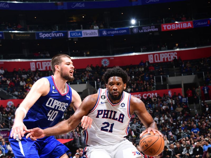 LOS ANGELES, CA - JANUARY 17: Joel Embiid #21 of the Philadelphia 76ers dribbles the ball during the game against the LA Clippers on January 17, 2023 at Crypto.Com Arena in Los Angeles, California. NOTE TO USER: User expressly acknowledges and agrees that, by downloading and/or using this Photograph, user is consenting to the terms and conditions of the Getty Images License Agreement. Mandatory Copyright Notice: Copyright 2023 NBAE (Photo by Adam Pantozzi/NBAE via Getty Images)