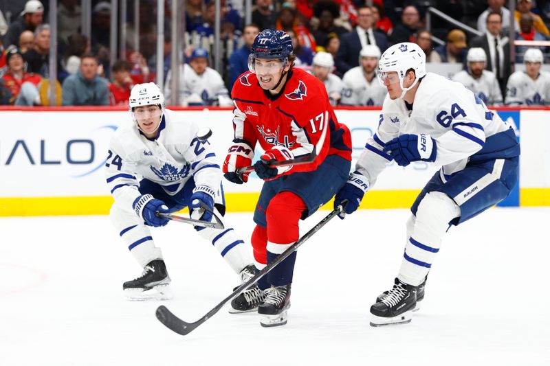 Mar 20, 2024; Washington, District of Columbia, USA; Washington Capitals center Dylan Strome (17) battles the puck between Toronto Maple Leafs center Connor Dewar (24) and Maple Leafs center David Kampf (64) during the third period at Capital One Arena. Mandatory Credit: Amber Searls-USA TODAY Sports