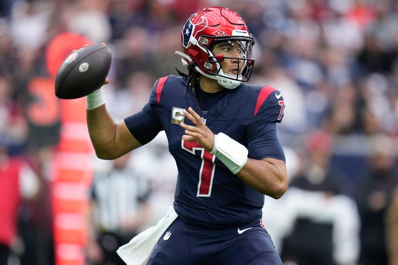 Houston Texans quarterback C.J. Stroud (7) drops back to pass against the Arizona Cardinals during the first half of an NFL football game Sunday, Nov. 19, 2023, in Houston. (AP Photo/Eric Christian Smith)