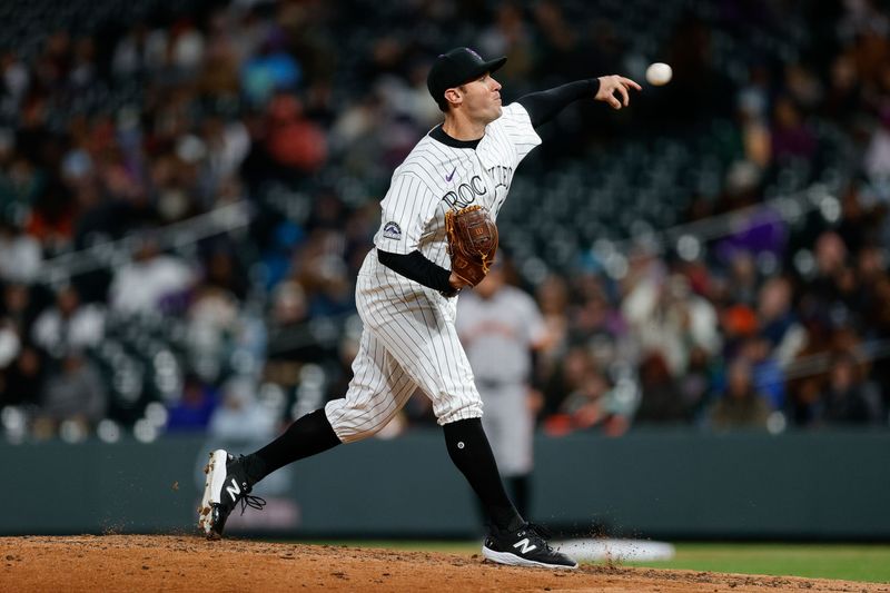 May 7, 2024; Denver, Colorado, USA; Colorado Rockies relief pitcher Ty Blach (50) pitches in the seventh inning against the San Francisco Giants at Coors Field. Mandatory Credit: Isaiah J. Downing-USA TODAY Sports