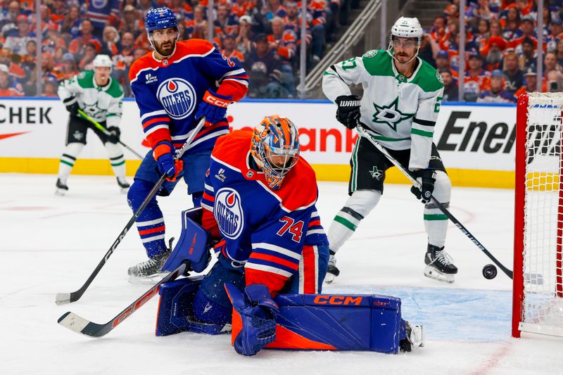 May 27, 2025; Edmonton, Alberta, CAN; Edmonton Oilers goaltender Stuart Skinner (74) allows a goal to Dallas Stars left wing Jason Robertson (not pictured) as left wing Mason Marchment (27) looks on during the second period in game four of the Western Conference Final of the 2025 Stanley Cup Playoffs at Rogers Place. Mandatory Credit: Perry Nelson-Imagn Images