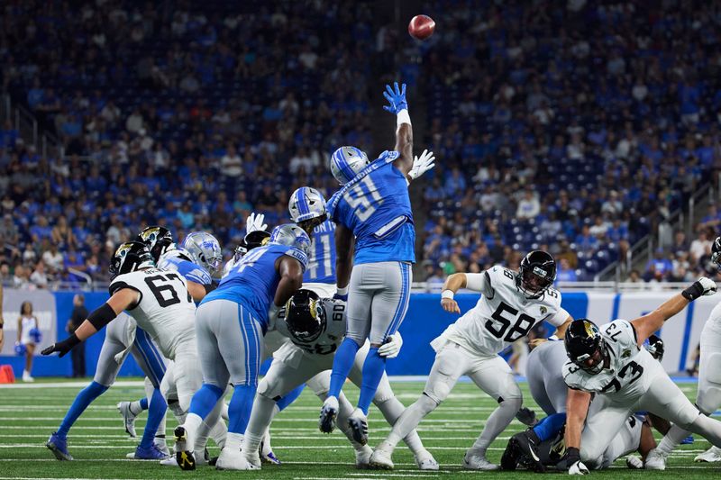 Detroit Lions defensive end Levi Onwuzurike (91) tries to block a kick against the Jasksonville Jaguars during an NFL pre-season football game, Saturday, Aug. 19, 2023, in Detroit. (AP Photo/Rick Osentoski)