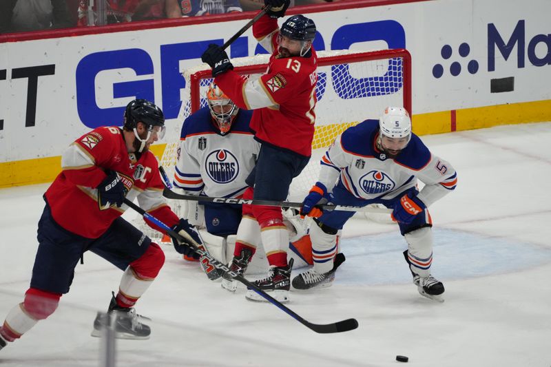 Jun 24, 2024; Sunrise, Florida, USA; Edmonton Oilers defenseman Cody Ceci (5) looks on after blocking a shot on net as Florida Panthers forward Aleksander Barkov (16) reaches for the puck during the third period in game seven of the 2024 Stanley Cup Final at Amerant Bank Arena. Mandatory Credit: Jim Rassol-USA TODAY Sports