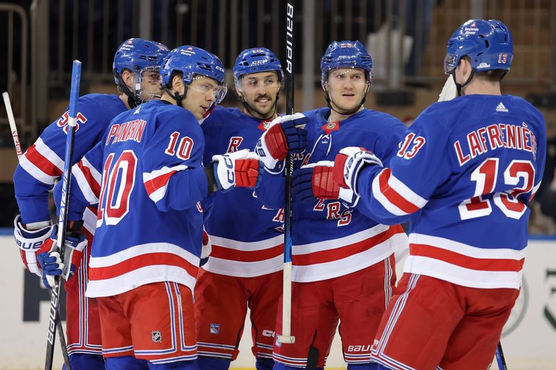 Feb 20, 2024; New York, New York, USA; New York Rangers defenseman Adam Fox (23) celebrates his goal against the Dallas Stars with left wing Artemi Panarin (10) and defenseman Ryan Lindgren (55) and center Vincent Trocheck (16) and left wing Alexis Lafreniere (13) during the first period at Madison Square Garden. Mandatory Credit: Brad Penner-USA TODAY Sports