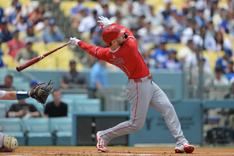 May 18, 2025; Los Angeles, California, USA;  Los Angeles Angels outfielder Taylor Ward (3) hits a two run home run against the Los Angeles Dodgers in the first inning at Dodger Stadium. Mandatory Credit: Jayne Kamin-Oncea-Imagn Images