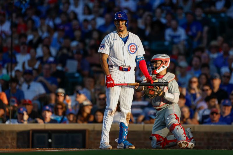 Jul 3, 2024; Chicago, Illinois, USA; Chicago Cubs third baseman Christopher Morel (5) reacts after striking out against the Philadelphia Phillies during the second inning at Wrigley Field. Mandatory Credit: Kamil Krzaczynski-USA TODAY Sports