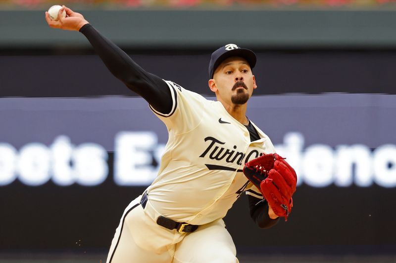 Jun 12, 2024; Minneapolis, Minnesota, USA; Minnesota Twins starting pitcher Pablo Lopez (49) throws to the Colorado Rockies in the first inning at Target Field. Mandatory Credit: Bruce Kluckhohn-USA TODAY Sports