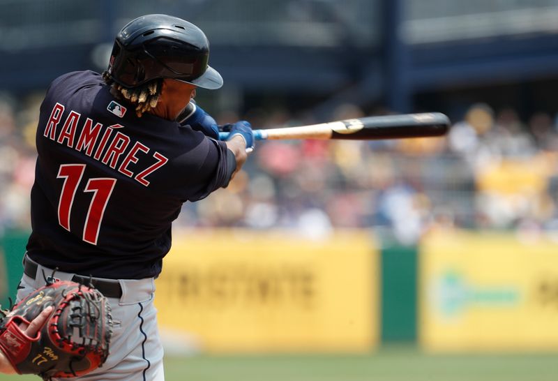 Jul 19, 2023; Pittsburgh, Pennsylvania, USA;  Cleveland Guardians designated hitter Jose Ramirez (11) hits a single against the Pittsburgh Pirates during the fourth inning at PNC Park. Mandatory Credit: Charles LeClaire-USA TODAY Sports