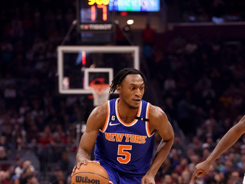 CLEVELAND, OH - MARCH 31: Immanuel Quickley #5 of the New York Knicks drives to the basket against the Cleveland Cavaliers  on March 31, 2023 at Rocket Mortgage FieldHouse in Cleveland, Ohio. NOTE TO USER: User expressly acknowledges and agrees that, by downloading and/or using this Photograph, user is consenting to the terms and conditions of the Getty Images License Agreement. Mandatory Copyright Notice: Copyright 2023 NBAE (Photo by  Lauren Leigh Bacho/NBAE via Getty Images)