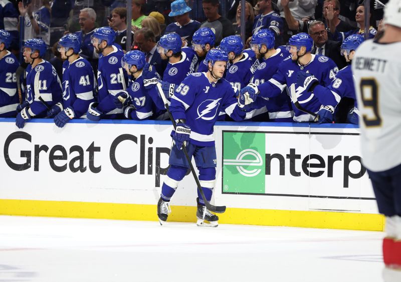 Apr 30, 2025; Tampa, Florida, USA; Tampa Bay Lightning center Jake Guentzel (59) is congratulated  after he scored a goal against the Florida Panthers during the second period of game five of the first round of the 2025 Stanley Cup Playoffs at Amalie Arena. Mandatory Credit: Kim Klement Neitzel-Imagn Images