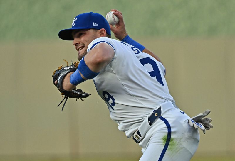 May 21, 2024; Kansas City, Missouri, USA;  Kansas City Royals second baseman Michael Massey (19) throws the ball to first base for an out in the fourth inning against the Detroit Tigers at Kauffman Stadium. Mandatory Credit: Peter Aiken-USA TODAY Sports