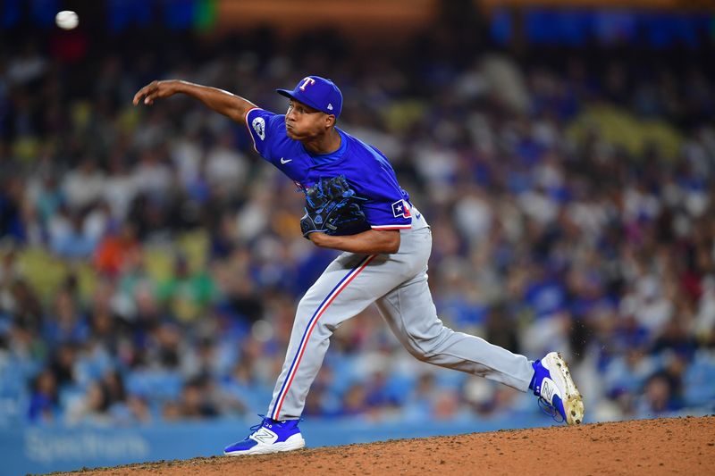 Jun 12, 2024; Los Angeles, California, USA; Texas Rangers pitcher José Leclerc (25) throws against the Los Angeles Dodgers during the sixth inning at Dodger Stadium. Mandatory Credit: Gary A. Vasquez-USA TODAY Sports