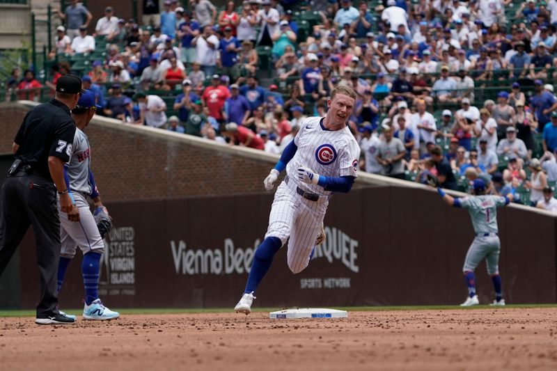 Jun 22, 2024; Chicago, Illinois, USA; Chicago Cubs outfielder Pete Crow-Armstrong (52) runs the bases after hitting an RBI triple against the New York Mets during the first inning at Wrigley Field. Mandatory Credit: David Banks-USA TODAY Sports