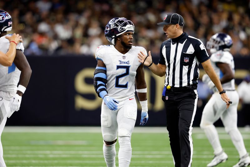 Tennessee Titans linebacker Azeez Al-Shaair (2) talks with side judge Jeff Lamberth (21) during an NFL football game against the New Orleans Saints, Sunday, Sep. 10, 2023, in New Orleans. (AP Photo/Tyler Kaufman)