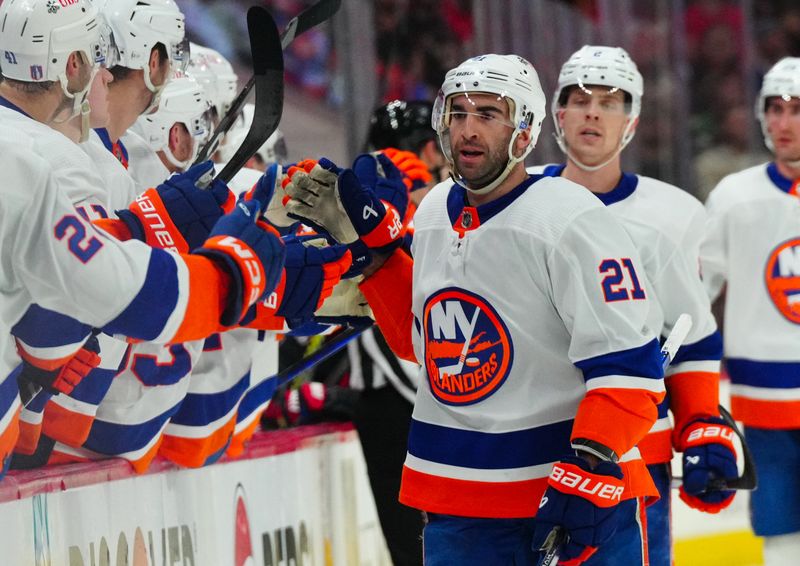 Apr 22, 2024; Raleigh, North Carolina, USA; New York Islanders center Kyle Palmieri (21) celebrates his goal against the Carolina Hurricanes during the first period in game two of the first round of the 2024 Stanley Cup Playoffs at PNC Arena. Mandatory Credit: James Guillory-USA TODAY Sports