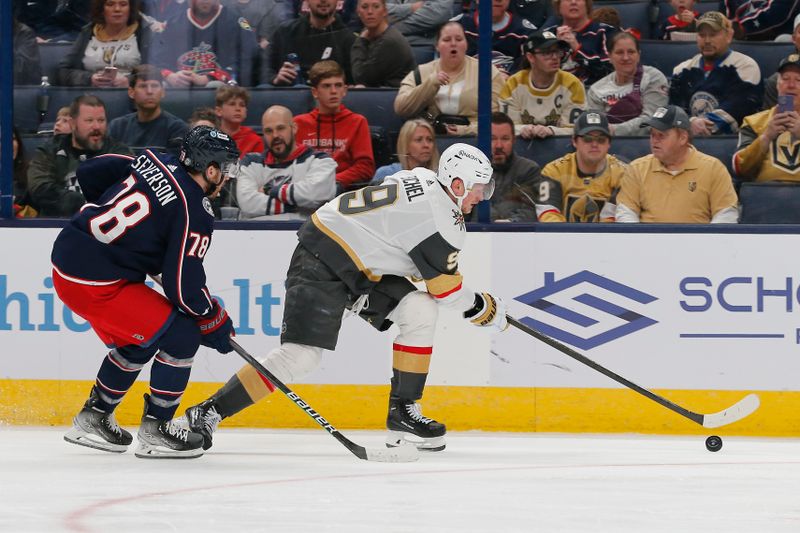 Mar 4, 2024; Columbus, Ohio, USA; Vegas Golden Knights center Jack Eichel (9) reaches for a loose puck as Columbus Blue Jackets defenseman Damon Severson (78) defends during the first period at Nationwide Arena. Mandatory Credit: Russell LaBounty-USA TODAY Sports