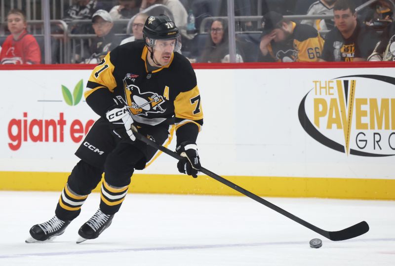 Mar 22, 2026; Pittsburgh, Pennsylvania, USA;  Pittsburgh Penguins center Evgeni Malkin (71) skates up ice with the puck against the Carolina Hurricanes during the first period at PPG Paints Arena. Mandatory Credit: Charles LeClaire-Imagn Images