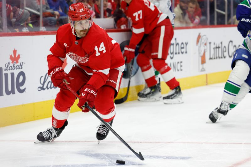 Dec 1, 2024; Detroit, Michigan, USA;  Detroit Red Wings center Tyler Motte (14) skates with the puck in the first period against the Vancouver Canucks at Little Caesars Arena. Mandatory Credit: Rick Osentoski-Imagn Images