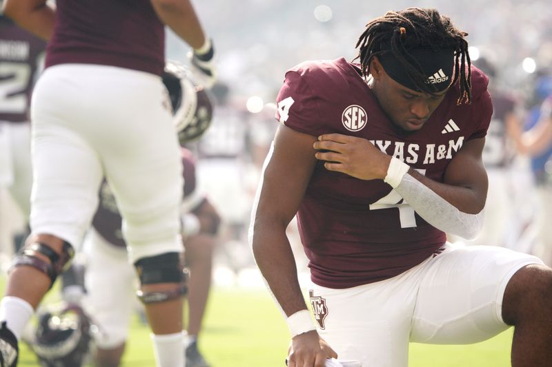 Oct 28, 2023; College Station, Texas, USA; Texas A&M Aggies running back Amari Daniels (4) takes a knee before a game against South Carolina Gamecocks at Kyle Field. Mandatory Credit: Dustin Safranek-USA TODAY Sports