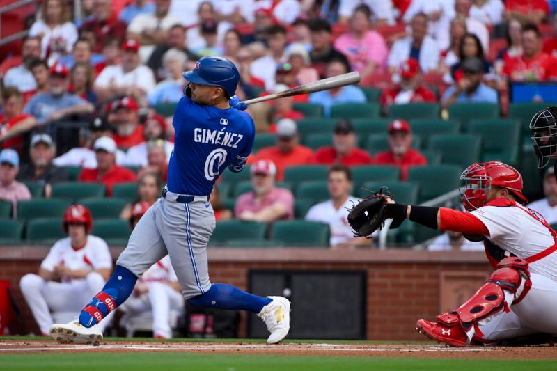 Jun 10, 2025; St. Louis, Missouri, USA;  Toronto Blue Jays second baseman Andres Gimenez (0) hits a three run home run against the St. Louis Cardinals during the first inning at Busch Stadium. Mandatory Credit: Jeff Curry-Imagn Images