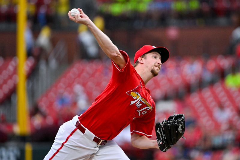 Aug 7, 2024; St. Louis, Missouri, USA;  St. Louis Cardinals starting pitcher Erick Fedde (12) pitches against the Tampa Bay Rays during the first inning at Busch Stadium. Mandatory Credit: Jeff Curry-USA TODAY Sports