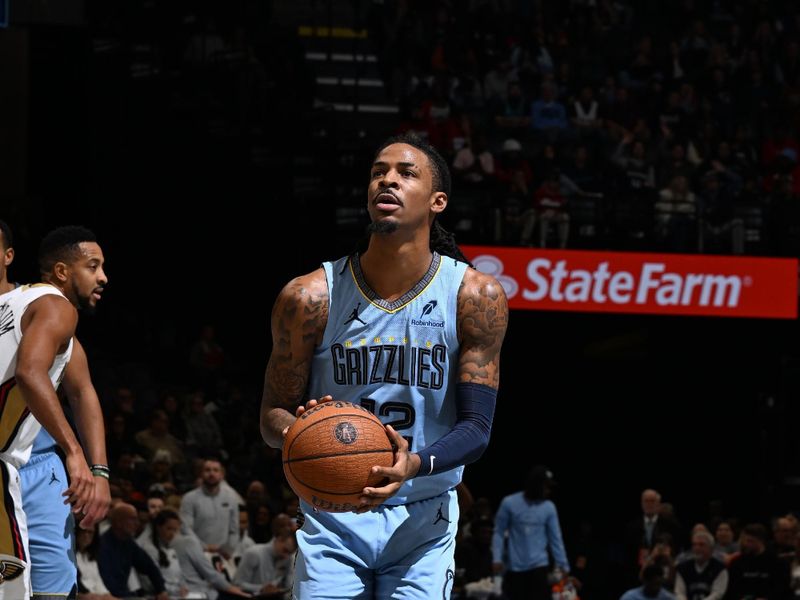 MEMPHIS, TN - NOVEMBER 29: Ja Morant #12 of the Memphis Grizzlies shoots a free throw during the game against the New Orleans Pelicans during the Emirates NBA Cup game on November 29, 2024 at FedExForum in Memphis, Tennessee. NOTE TO USER: User expressly acknowledges and agrees that, by downloading and or using this photograph, User is consenting to the terms and conditions of the Getty Images License Agreement. Mandatory Copyright Notice: Copyright 2024 NBAE (Photo by Grant Burke/NBAE via Getty Images)