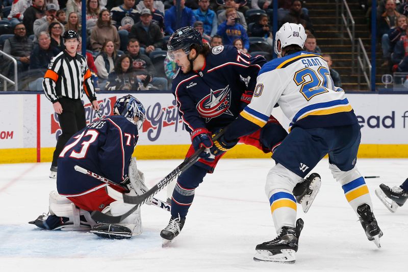 Dec 8, 2023; Columbus, Ohio, USA; Columbus Blue Jackets goalie Jet Greaves (73) makes a save as St. Louis Blues left wing Brandon Saad (20) looks for a rebound during the first period at Nationwide Arena. Mandatory Credit: Russell LaBounty-USA TODAY Sports