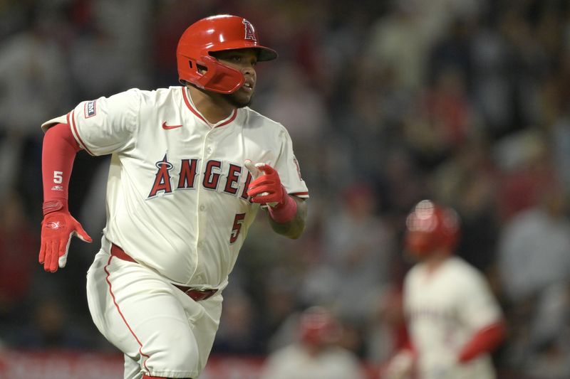 May 30, 2024; Anaheim, California, USA;  Los Angeles Angels first baseman Willie Calhoun (5) runs to first on a RBI single in the seventh inning against the New York Yankees at Angel Stadium. Mandatory Credit: Jayne Kamin-Oncea-USA TODAY Sports