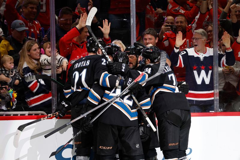 Nov 6, 2024; Washington, District of Columbia, USA; Washington Capitals left wing Alex Ovechkin (8) celebrates with teammates after scoring a goal against the Nashville Predators in the third period at Capital One Arena. Mandatory Credit: Geoff Burke-Imagn Images