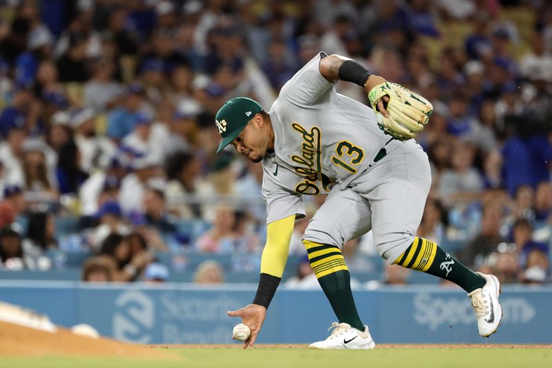 Aug 3, 2023; Los Angeles, California, USA;  Oakland Athletics third baseman Jordan Diaz (13) fields a ground ball during the sixth inning against the Los Angeles Dodgers at Dodger Stadium. Mandatory Credit: Kiyoshi Mio-USA TODAY Sports