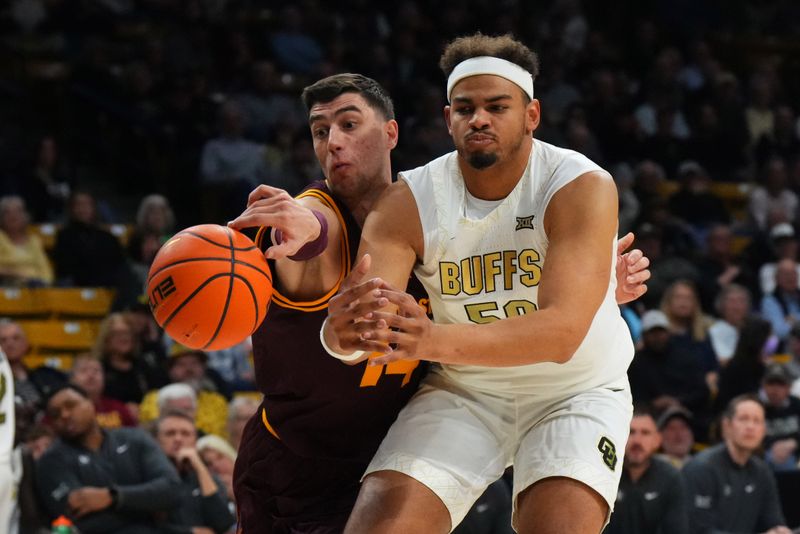 Feb 7, 2026; Boulder, Colorado, USA; Arizona State Sun Devils forward Andrija Grbovic (14) tips the ball away from Colorado Buffaloes center Elijah Malone (50) in the first half at the CU Events Center. Mandatory Credit: Ron Chenoy-Imagn Images